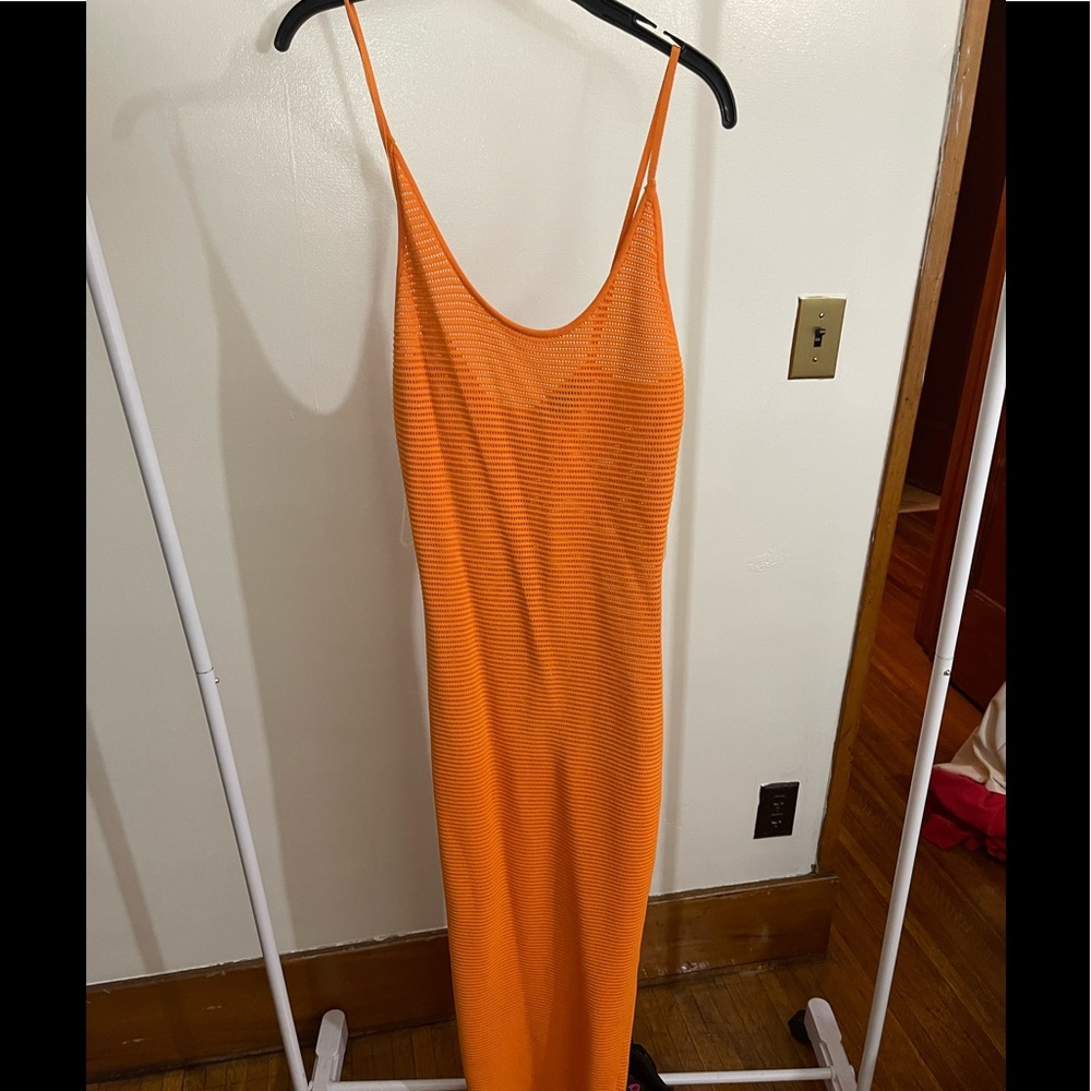 Naked wardrobe orange  net dress. Mid length with spaghetti straps.